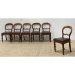 A set of six Victorian walnut dining chairs, with balloon backs, drop in seat pads and raised on