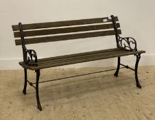 A traditional slatted teak and cast iron garden bench. L125cm.