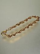 A 9ct gold triple oval chain link bracelet with lobster claw fastening, no signs of damage or