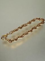 A 9ct gold triple oval chain link bracelet with lobster claw fastening, no signs of damage or