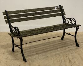 A traditional slatted teak and cast iron garden bench. L125cm.