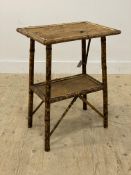 A Victorian bamboo two tier side table raised on splayed supports. H74cm, W54cm, D38cmn.