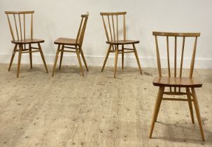 Ercol, a set of four beech and elm comb back dining chairs, each with gold label verso. H80cm.