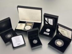 A collection of Queen Elizabeth II silver proof coins to include, a proof 50th anniversary