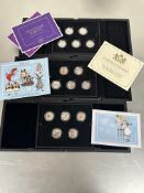 A case containing a set of five Isle Man silver proof Alice's Adventures In Woderland  fifty pence