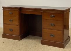 A mahogany twin pedestal desk, circa 1940's, the inverted break front top inset with writing surface