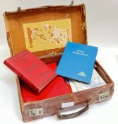 A vintage leather suitcase containing various stamps including KG6 Ceylon, L.M.M, North Borneo 1945,