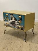 A Vintage painted chest of four three drawers with decoupage style decoration, raised on hairpin