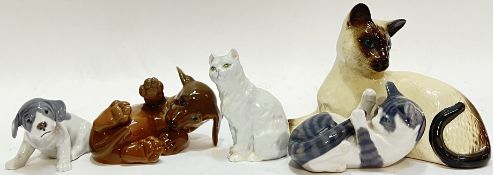 A group of ceramic animal figures comprising a Royal Doulton cat (h- 12cm, w- 19cm), three Royal