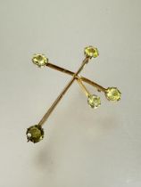 An Edwardian 9ct gold knife edge constellation brooch pendant set five peridots, shows no signs of