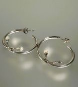 A pair of Danish Georg Jensen silver Torun hoop cross over earrings, set cultured seed pearl