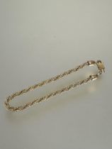 A 9ct gold triple spiral twist bead link bracelet with lobster claw fastening no signs of damage