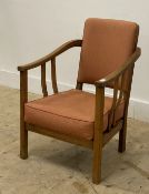 A small 1930's oak chair, with open arms, upholstered back and seat, raised on square section