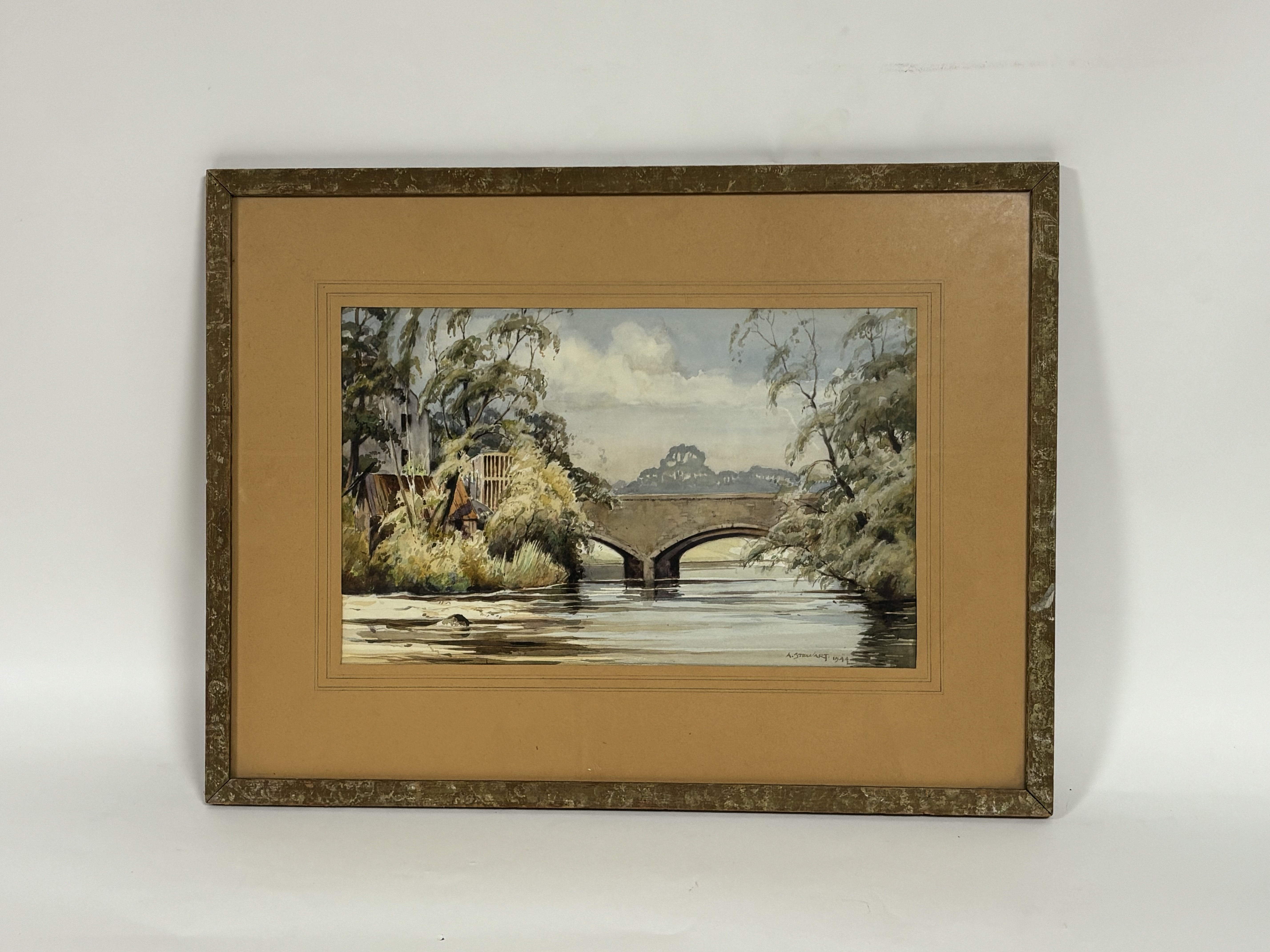 A. Stewart, riverbank bridge scene ,watercolour on paper, signed and dated 1944 bottom right in a