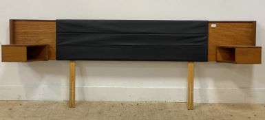 A mid century teak headboard with black vinyl panel and integrated floating side tables. L217cm.