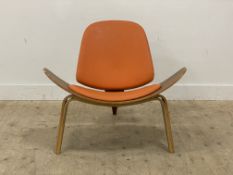 After Hans Wegner, a reproduction 'Shell' chair, of bent plywood construction, raised on three