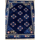 A Chinese super washed wool carpet, the blue ground decorated with repeating medallions and having a