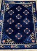A Chinese super washed wool carpet, the blue ground decorated with repeating medallions and having a