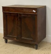 A Victorian pine and mahogany side cabinet, fitted with a drawer above two panelled doors, raised on