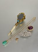 A collection of costume jewellery to include an oval purple paste set brooch L x 3.2cm , a paste