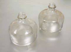 A pair of late 19tch/ 20thc hand blown clear glass lace makers lamps of circular barrel design and