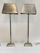 A pair of contemporary steel table lamps. H78cm.