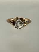 A continental yellow metal solitaire brilliant cut diamond ring in six claw setting, diamond
