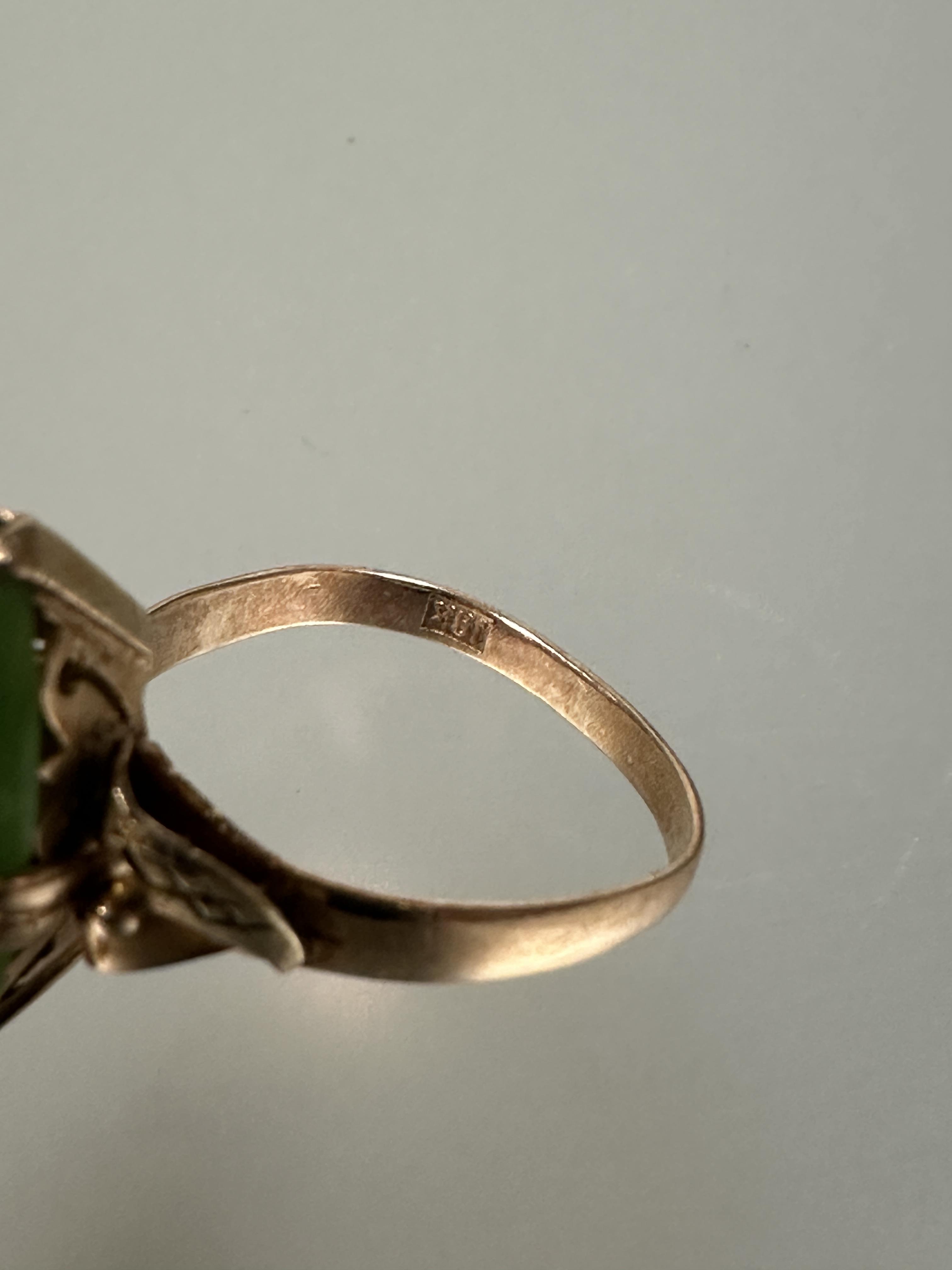 A 18ct gold ring set navette green stone mounted in four claw setting with scrolling leaf - Image 4 of 4