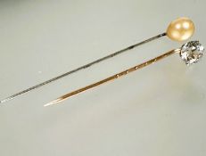 A 9ct gold stick pin set faceted clear stone L x 5cm 1.00g and a white metal stick pin set paste