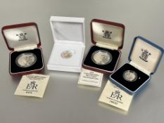 A collection of Queen Elizabeth II silver proof coins to include two Crowns, a  £1 coin, and