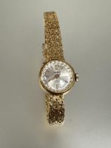 A 18ct gold Vewe ladys wrist watch with silvered satin dial and arabic numerals at 12 and 6 on