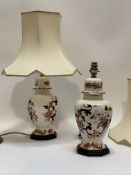 A pair of Contemporary Masons Ironstone table lamps of lidded and faceted baluster form, complete
