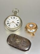 A Waltham USA white metal open face pocket watch with enamel dial and roman numerals, missing