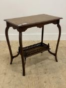 An Edwardian walnut occasional table, the rectangular lot on cabriole supports united by a galleried