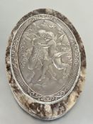 A gray alabaster oval panel mounted with continental plaque with chased fairy figures with