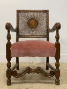 A walnut open armchair of 17th century design, circa 1930's, the back rest with bergere panel