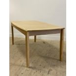 Ercol, a late 20th century / contemporary light oak extending dining table, with panelled top