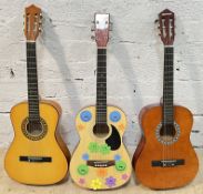 Three small size acoustic guitars including a Herald HL34, an eccentrically decorated Nevada W-309N,