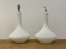A pair of contemporary white glass lamp bases of flask form, one lacking bulb holder. H39cm.