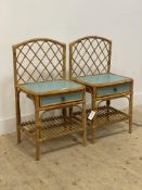 A pair of vintage bamboo and rattan bedside tables, each with raised lattice back, drawer and