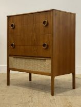 McIntosh of Kirkcaldy, A mid century teak chest, fitted with five drawers, raised on turned