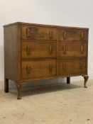 A 1930's / 40's oak six drawer side board standing on cabriole front supports. H96cm, W122cm,