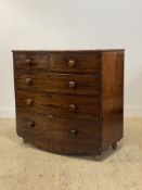 A Victorian mahogany bow front chest of drawers, fitted with two short and three long drawers