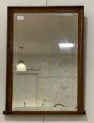 An early 20th century mahogany framed wall mirror with bevelled glass. 49cm x 67cm.