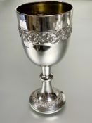 A Siam sterling silver weighted base goblet with chased scrolling leaf banded design and tapered