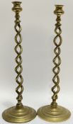 A pair of brass twist-stem candlestick holders (largest h- 47.5cm)