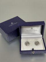 A pair of Danish Georg Jensen silver Torun circular scroll earrings stamped mark verso D x 0.5cm, in