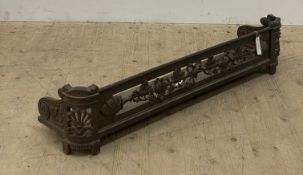 A 19th century cast iron fire fender, decorated with vining oak leaf, scroll and anthemion motifs.