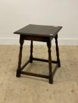 An 18th century style oak side table, the square moulded top above ring turned and block supports