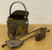 A 19th century planished brass coal scuttle with swing handle (H40cm) together with a matched set of